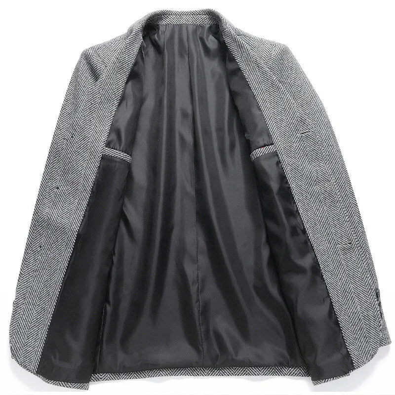 A man wearing a simple, loose-fit solid-colour woolen coat suitable for spring or autumn.