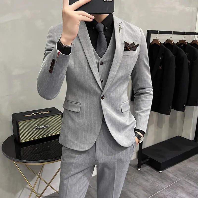 Men's three-piece striped suit set in black, slim fit, with jacket, vest and trousers on a hanger