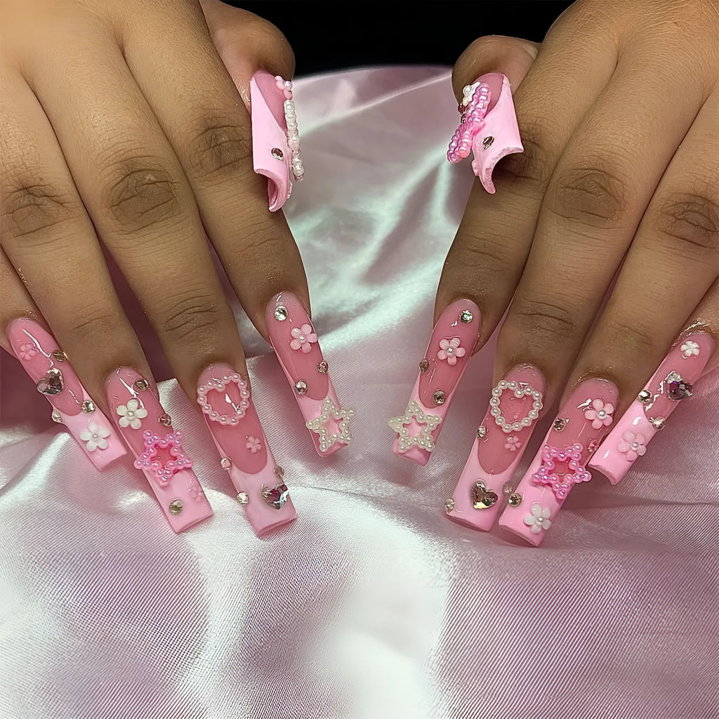 Wearable false nails with love pattern and French spot drill bows in XB-70-48 colour on a plastic armour suit.