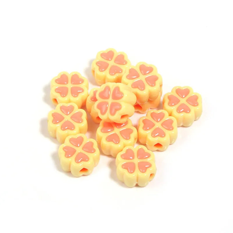 Assortment of 15mm frosted acrylic four-leaf clover beads in rose red, pink, yellow, green, blue, and purple.