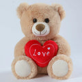 Cute heart-hugging teddy bear plush toy in brown, 30cm tall, standing on a white background