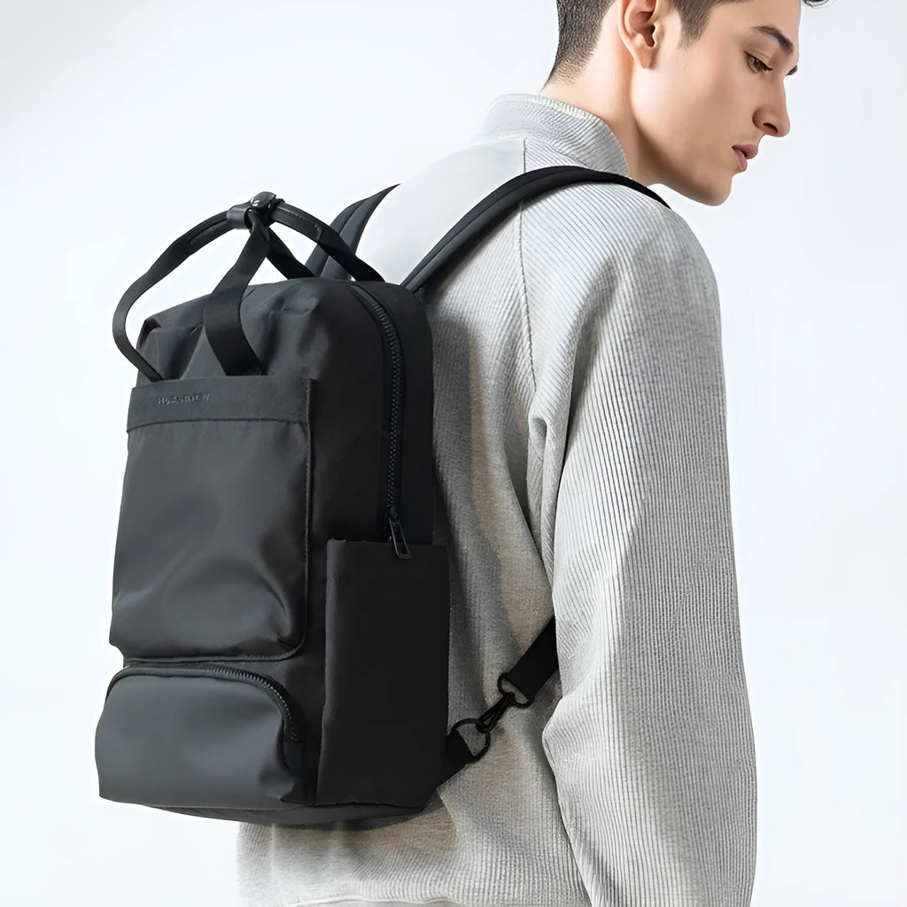 Black Oxford cloth computer backpack with a 20-35 litre capacity.