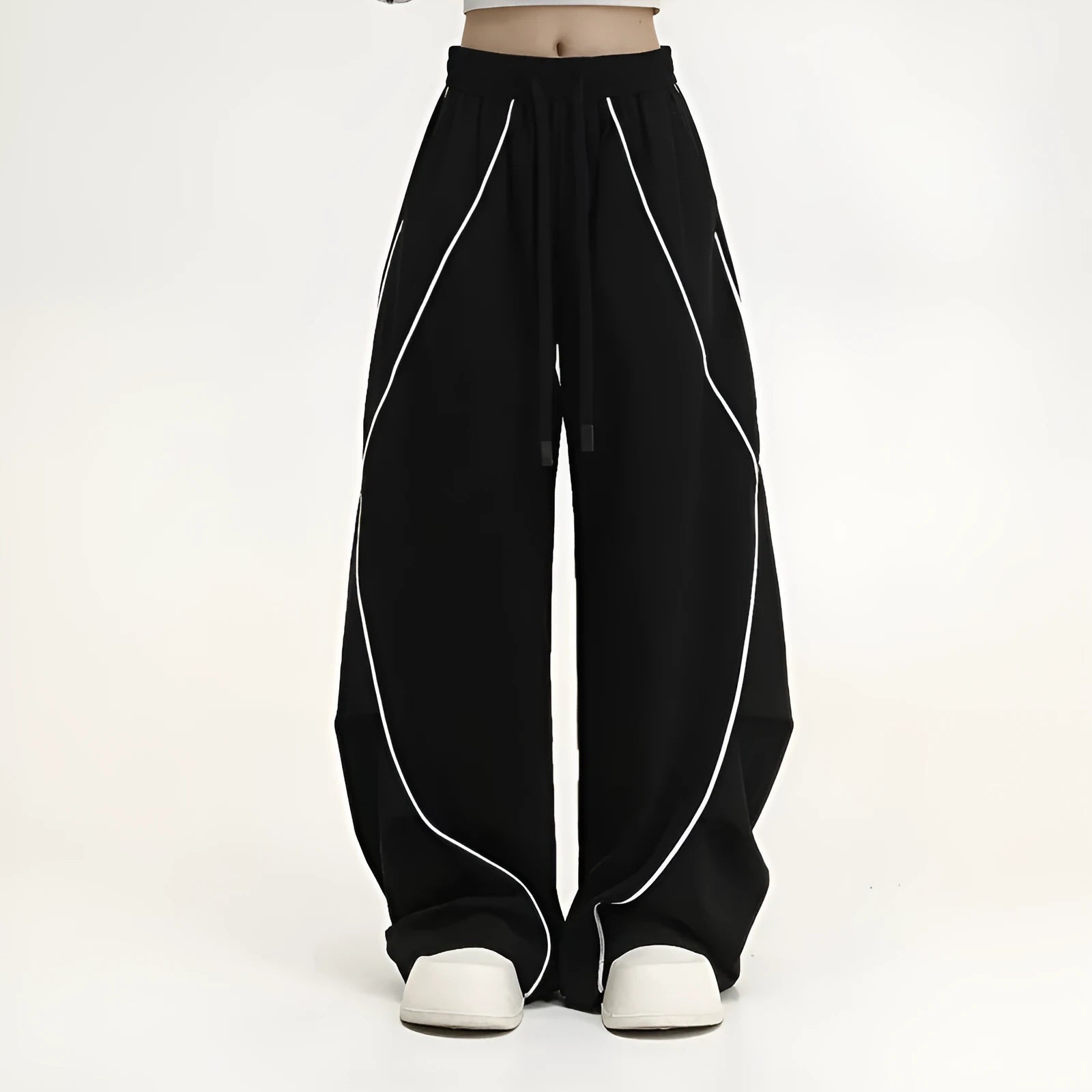Black striped pleated hip-hop wide-leg sports pants on a hanger.