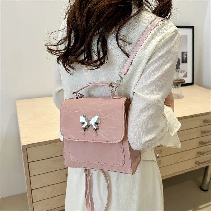 Women's preppy style PU backpack handbag with bow detail in light blue colour