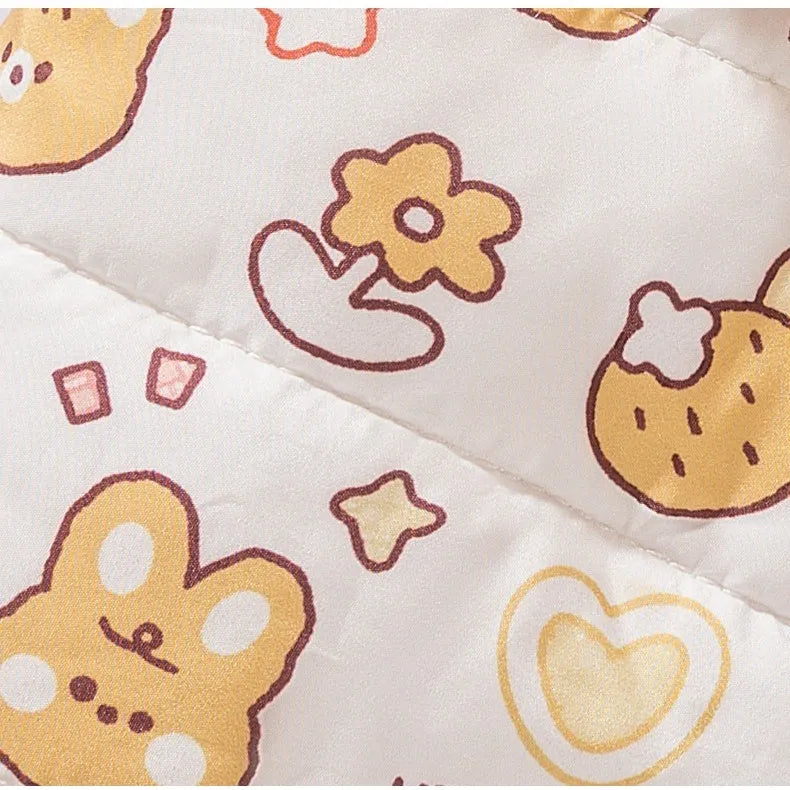 Yellow quilted cotton four-legged dog coat with sherpa hood and animal prints on a small dog