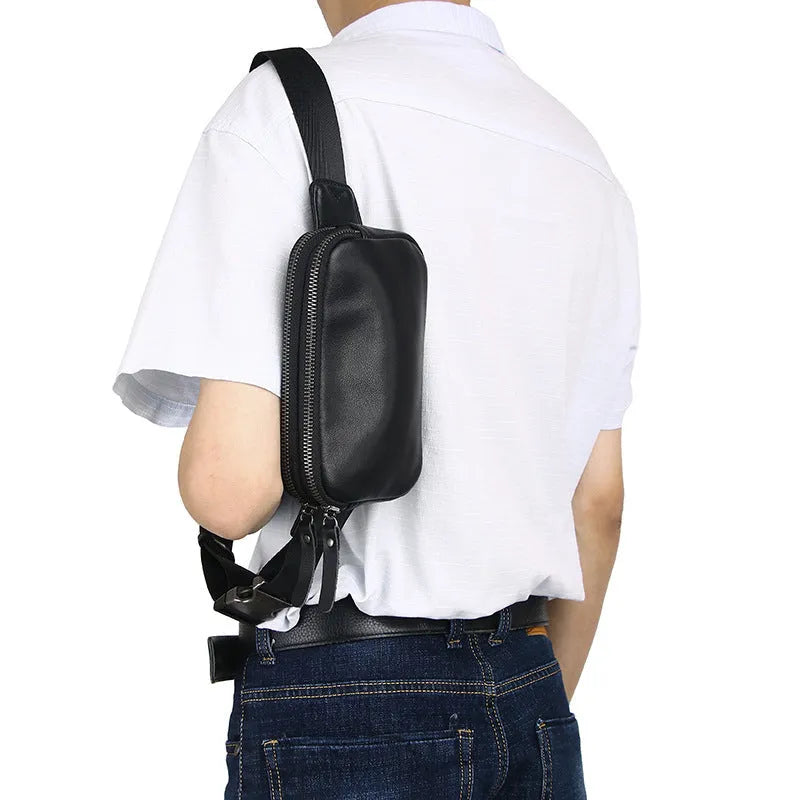 Small black cowhide leather crossbody bag for men with nylon lining.