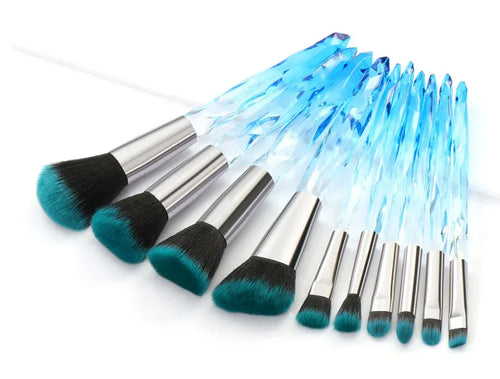 Set of ten clear crystal handle makeup brushes with diamond shank detail and artificial fibre bristles.