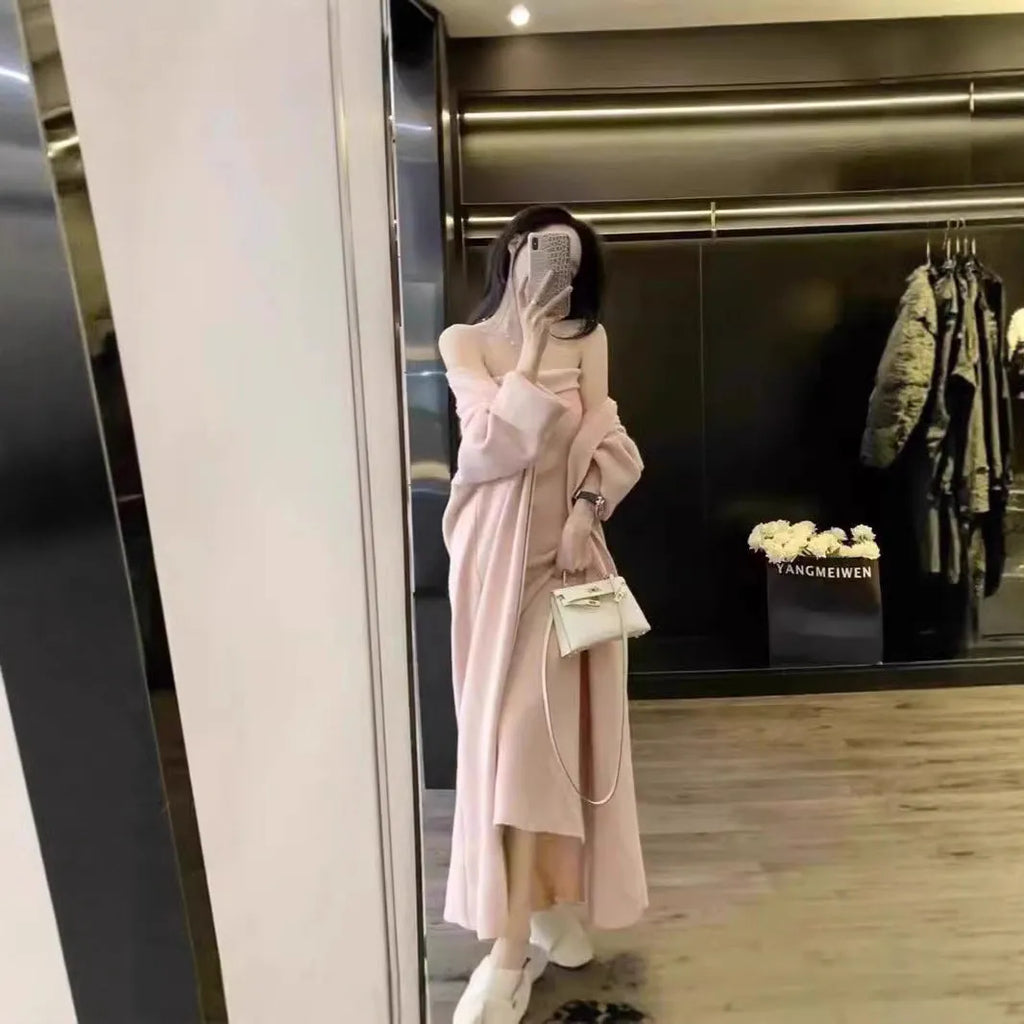 Women's grey knitted long-sleeve dress and matching cardigan set laid flat.
