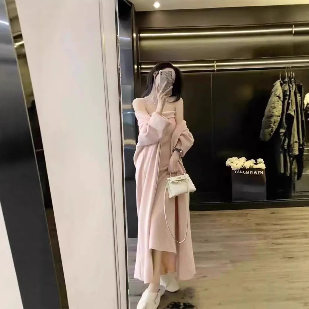 Women's grey knitted long-sleeve dress and matching cardigan set laid flat.
