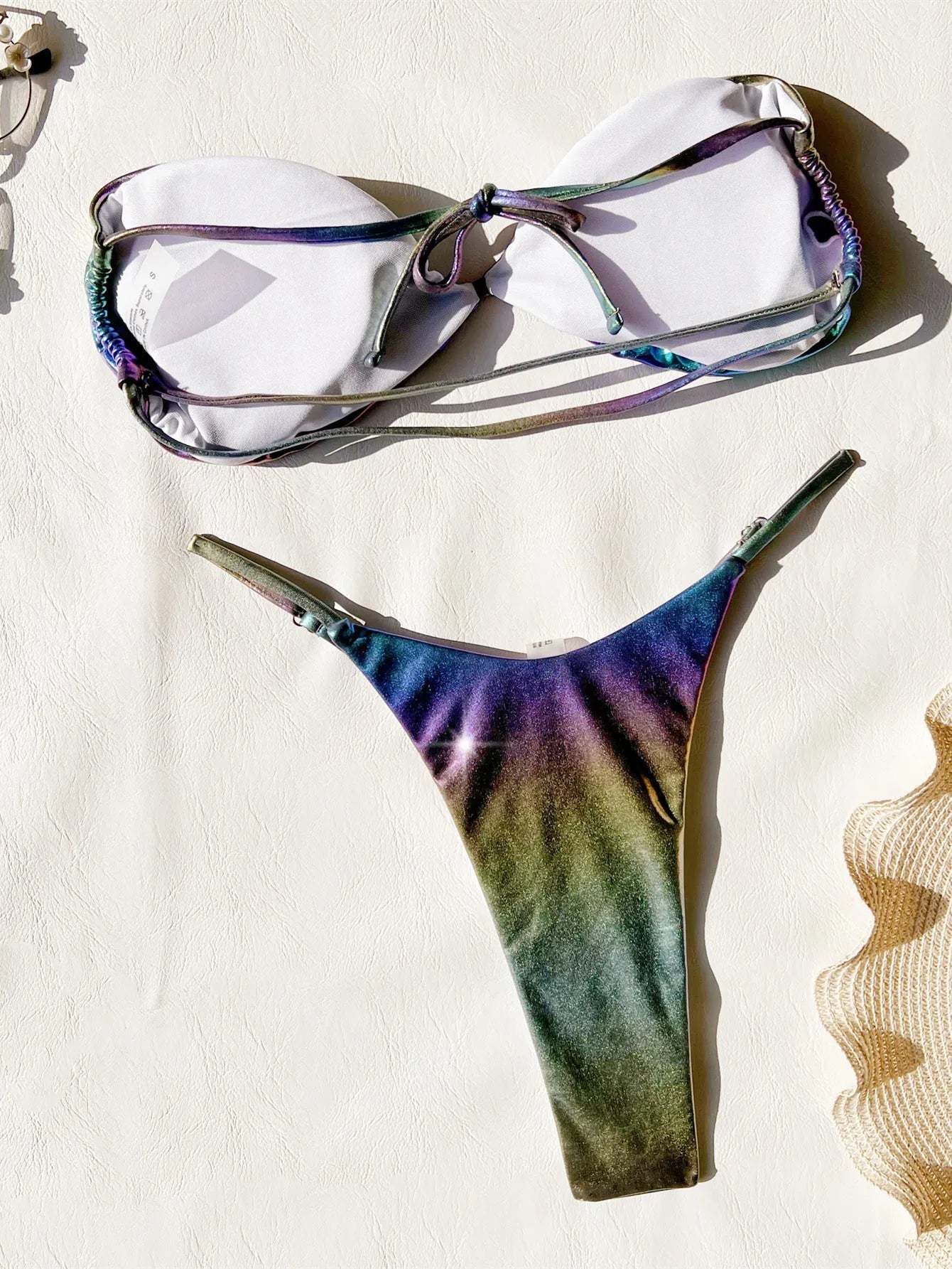 Women's gradient purple polyester bikini swimsuit top and bottom set.