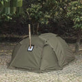 Double occupancy four-season tunnel tent with dome extension, olive green, pitched on grass with external and internal tents visible