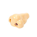 Flesh-coloured plastic pencil sharpener with large nostril and geometric shape on a white background.