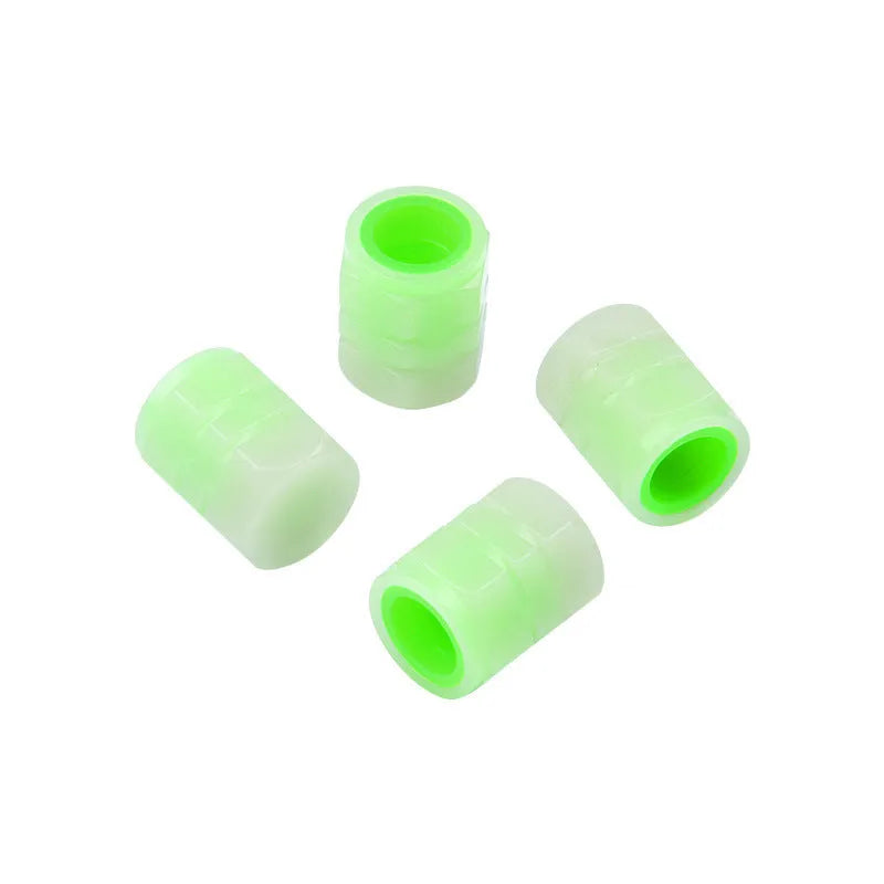 Glow-in-the-dark rubber car valve caps in 16x12mm size showing luminous property