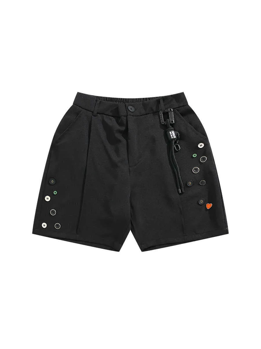 Man wearing black semi-elastic loose-fit shorts with a colour button fastening and zipper fly