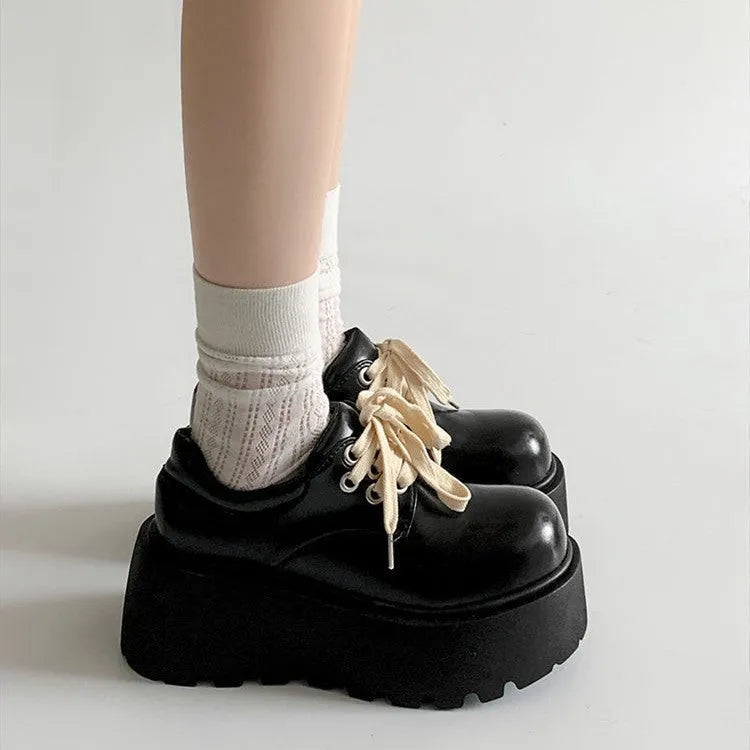 Matte black women's lace-up shoes with a chunky 6-8cm heel and round toe on a white background.