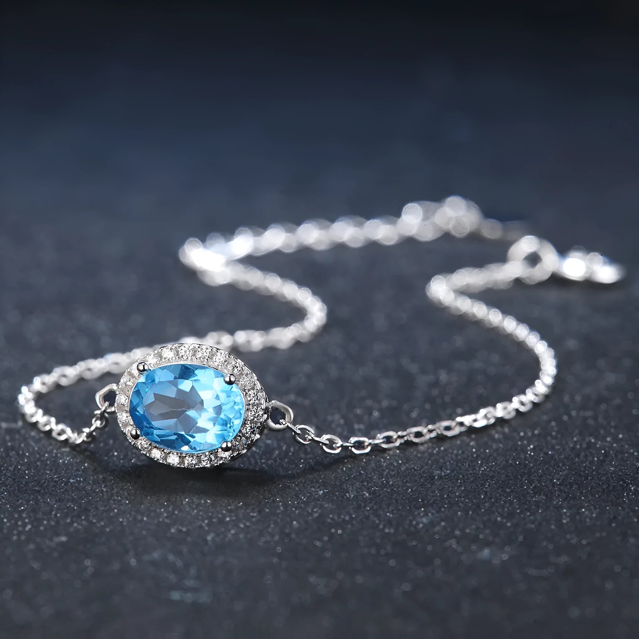 925 sterling silver geometric jewellery set with blue topaz gems including earrings, ring, necklace and pendant