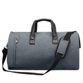 Oval-shaped medium travel bag in light grey with multiple internal compartments for wet-dry separation and organisation.