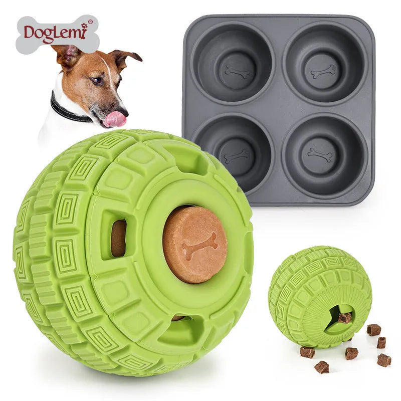 Green natural rubber dog ball with holes for food dropping, measuring 14cm long