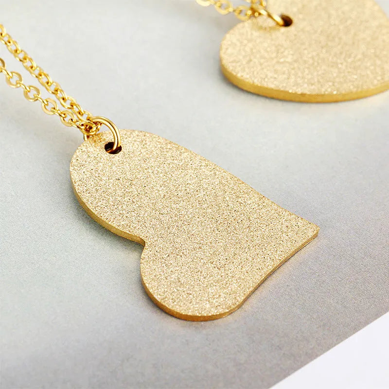 Geometric heart-shaped titanium steel necklace in silver colour with minimalist design