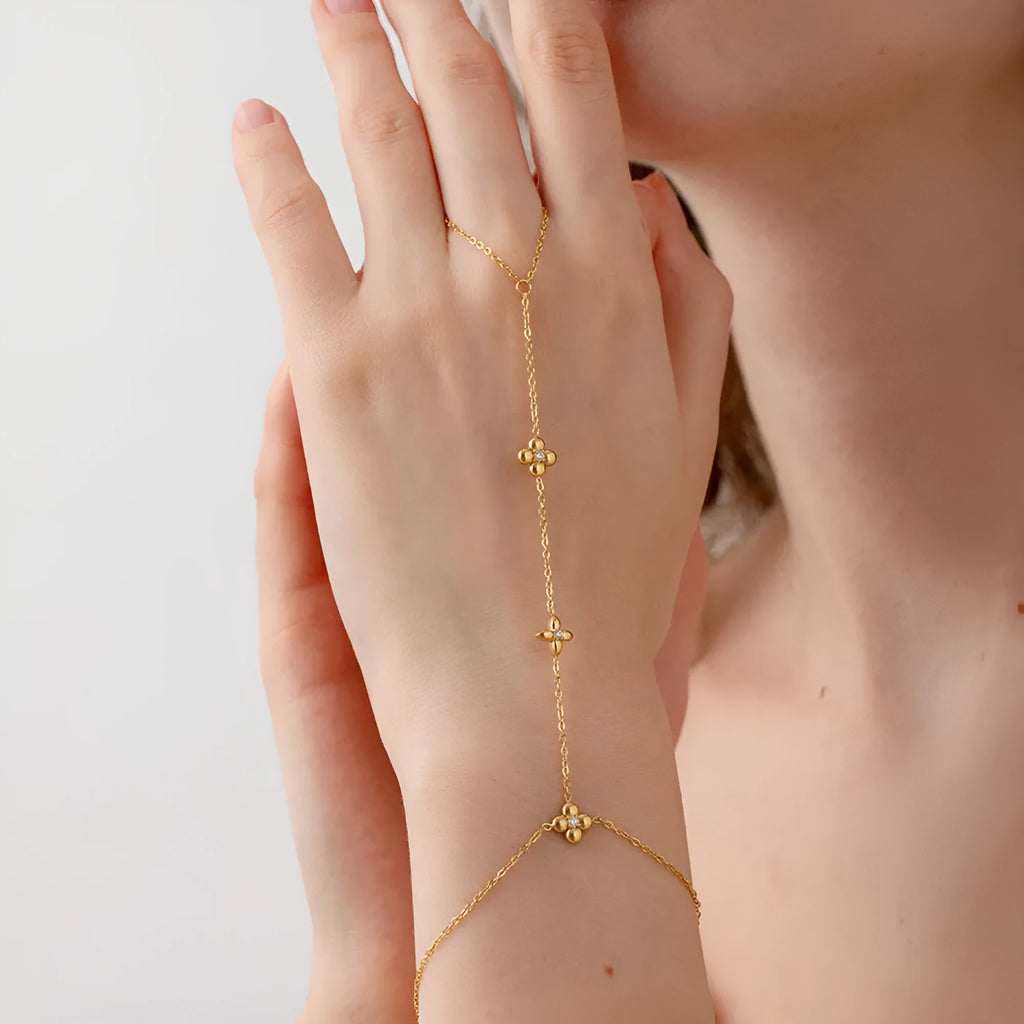 Women's stainless steel bracelet with geometric floral and eight-pointed star design in gold colour