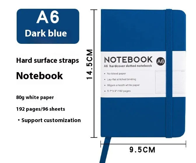 A5 size notebook with soft skin-feel PU leather cover and strap closure, open to show horizontal lined pages.