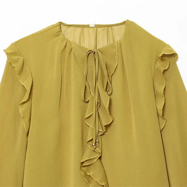 Women's ruffled laminated decorative shirt in yellow with plant and flower print, long sleeves, and button detail