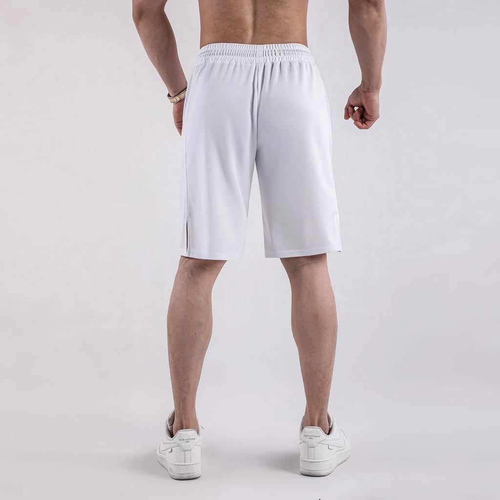 Man wearing black quick-dry mesh capri shorts with a loose, casual fit.