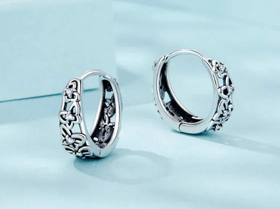 Retro hollow butterfly sterling silver 925 earrings with zircon accents, 14mm tall.