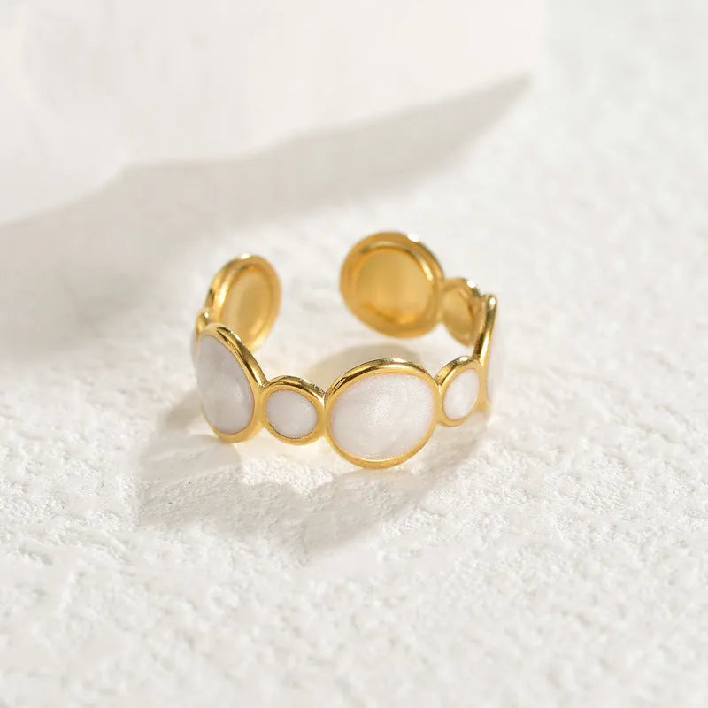 Stainless steel geometric ring with an adjustable opening band for women.
