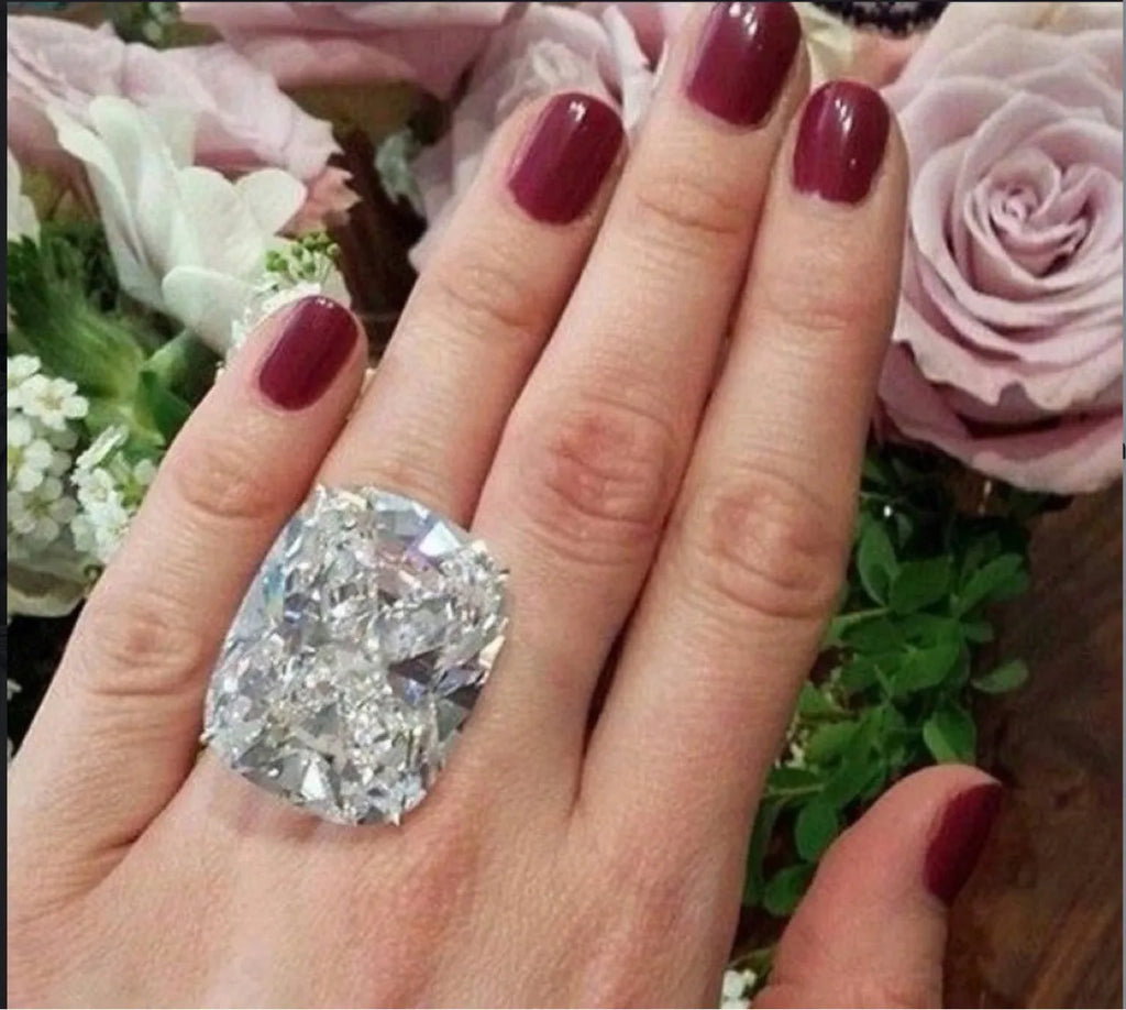 Women's square diamond ring with electroplated white gold colour and geometric design showing inlaid white stones