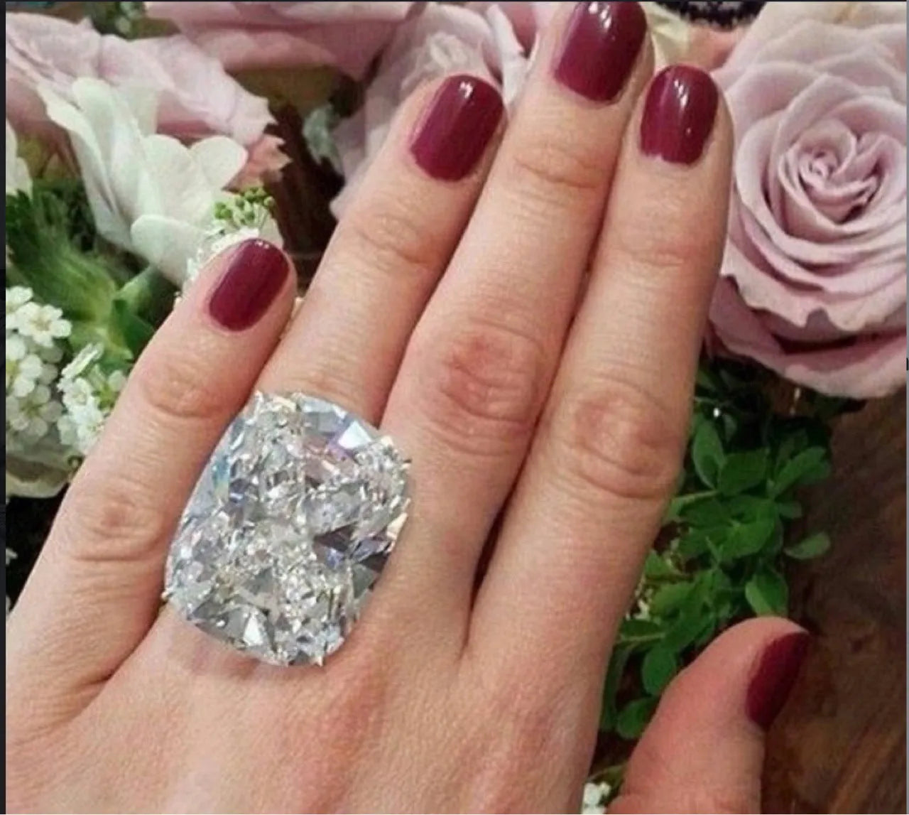 Women's square diamond ring with electroplated white gold colour and geometric design showing inlaid white stones