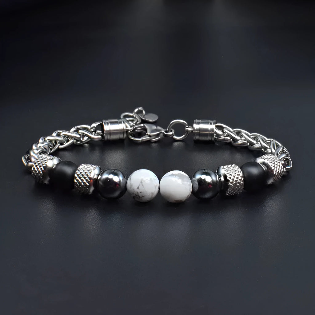 Titanium steel polished bracelet with yellow tiger eye beads and iron accents on white background