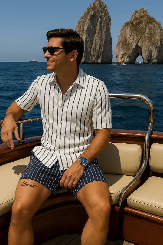 Man wearing a light mature casual style beach shirt and shorts matching set.