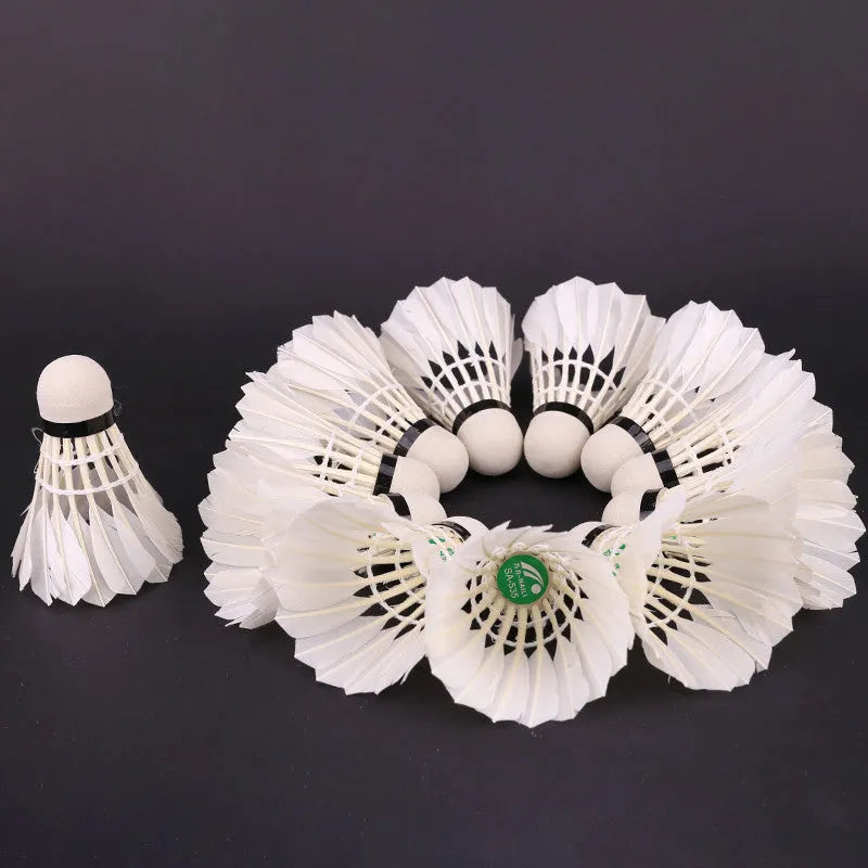 Twelve white training badminton shuttlecocks with feather skirts and cork bases arranged in a pack