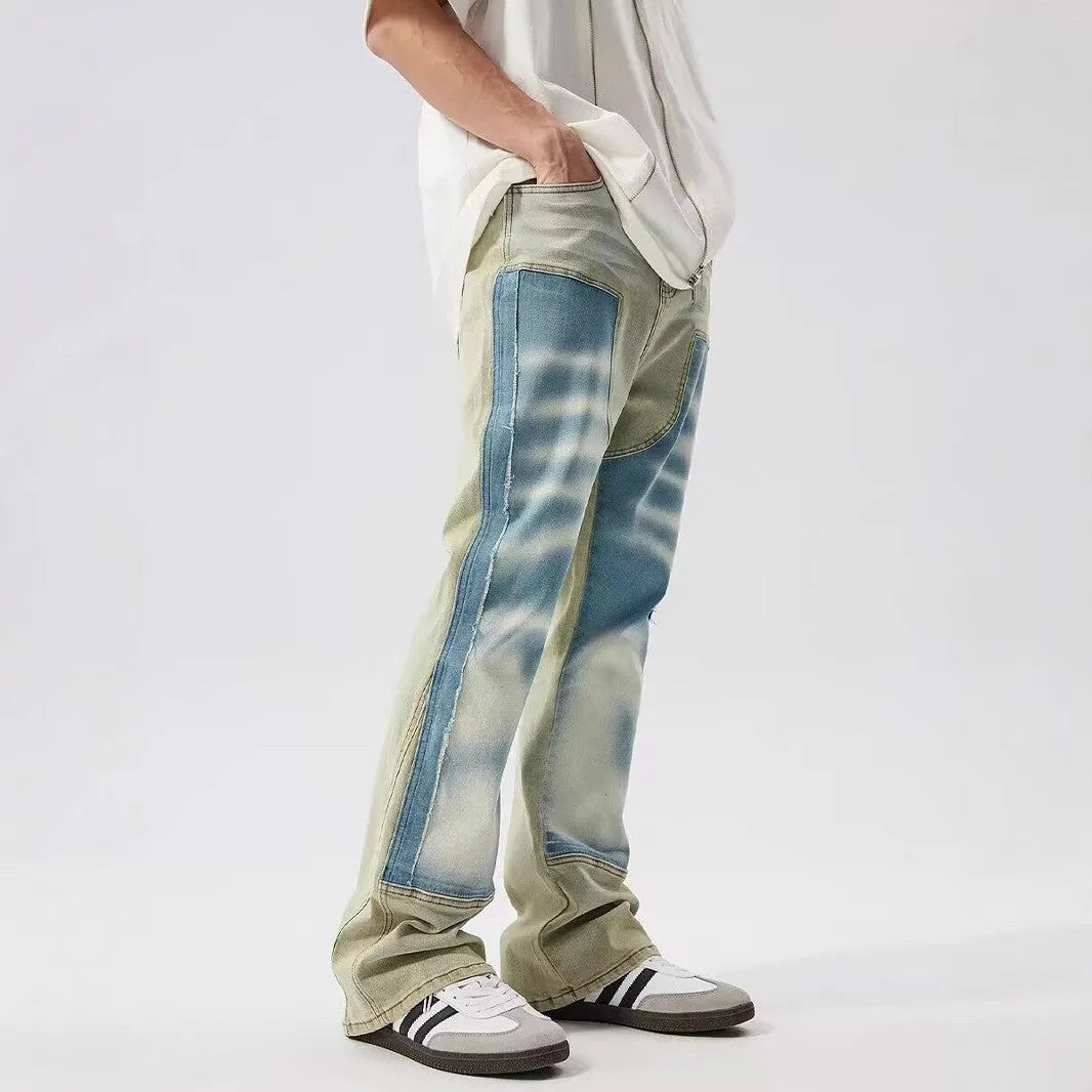 Yellow and blue retro patchwork splash-ink damaged design jeans with a zip fly.