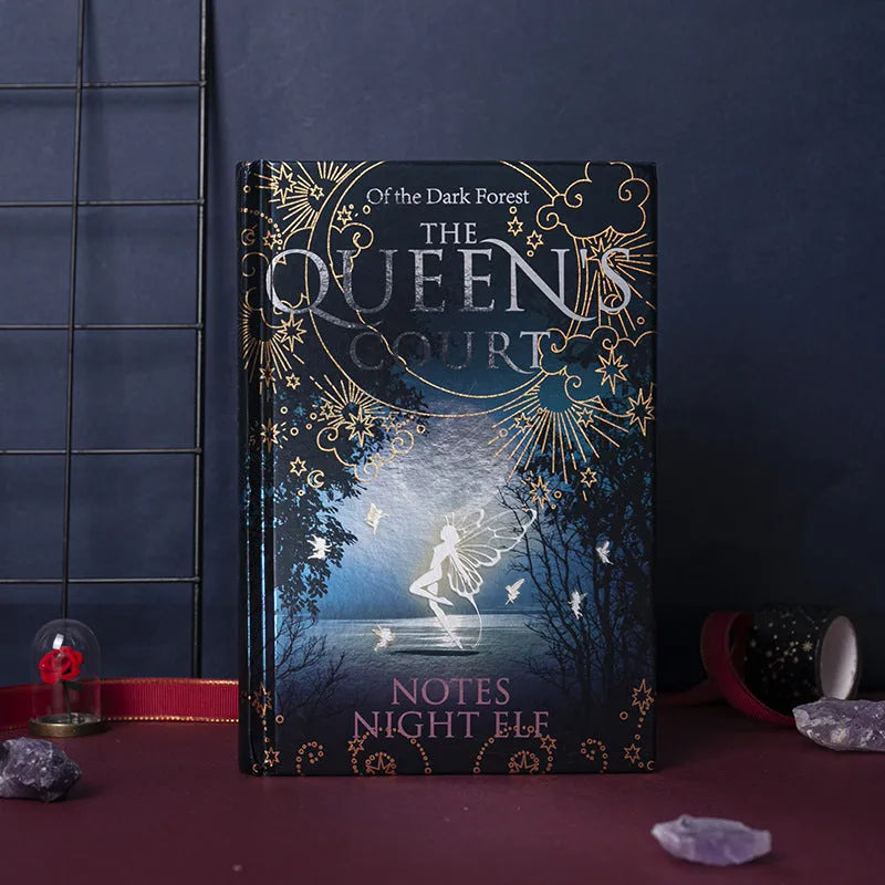 Blue glow in the dark A5 hardcover notebook showing luminous effect and colourful illustrated pages