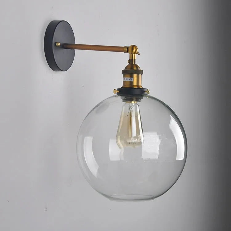 20cm round retro glass wall lamp with an aluminium holder in amber finish