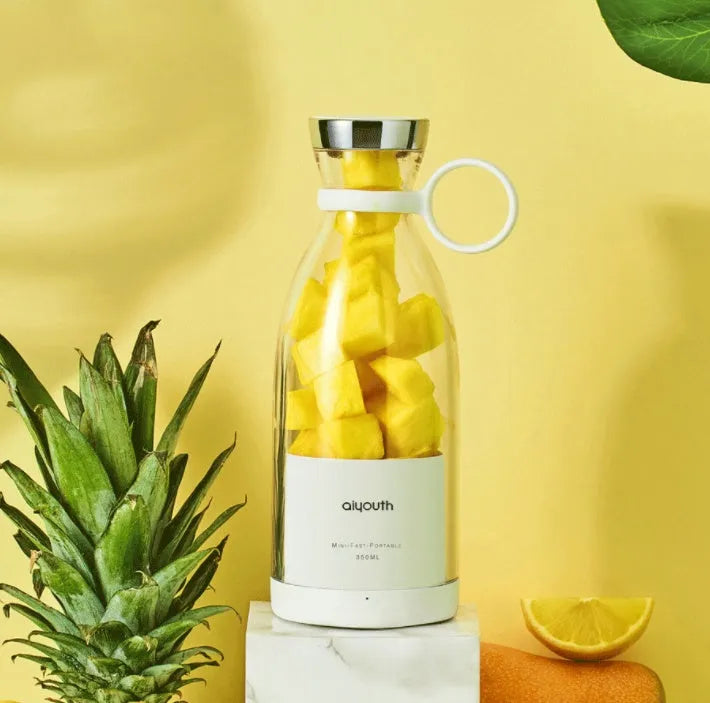Portable handheld electric juicer with USB charging cable in pink or white colour options