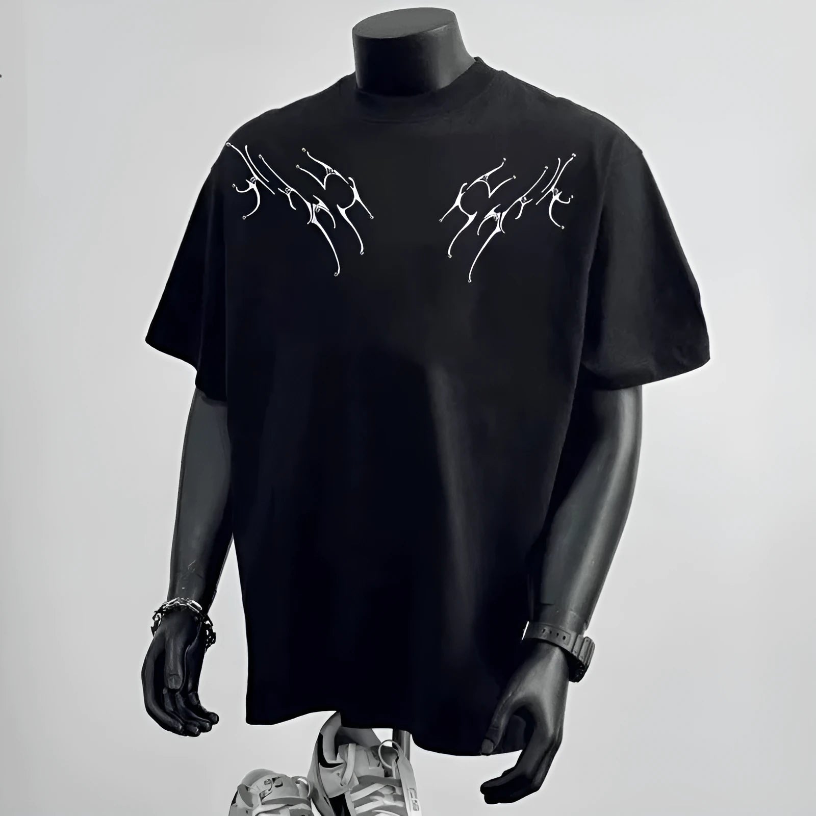 Man wearing a loose-fitting black pure cotton short sleeve top suitable for business casual wear.