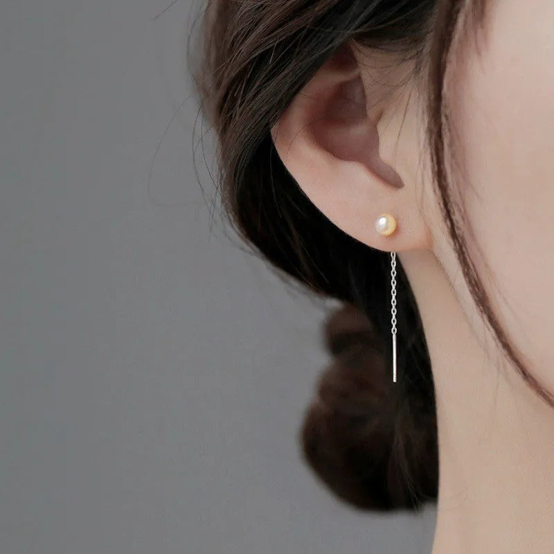 Sterling silver needle ear strings showing twelve hanging earring designs including pearls, clay balls, geometric shapes and zircon styles