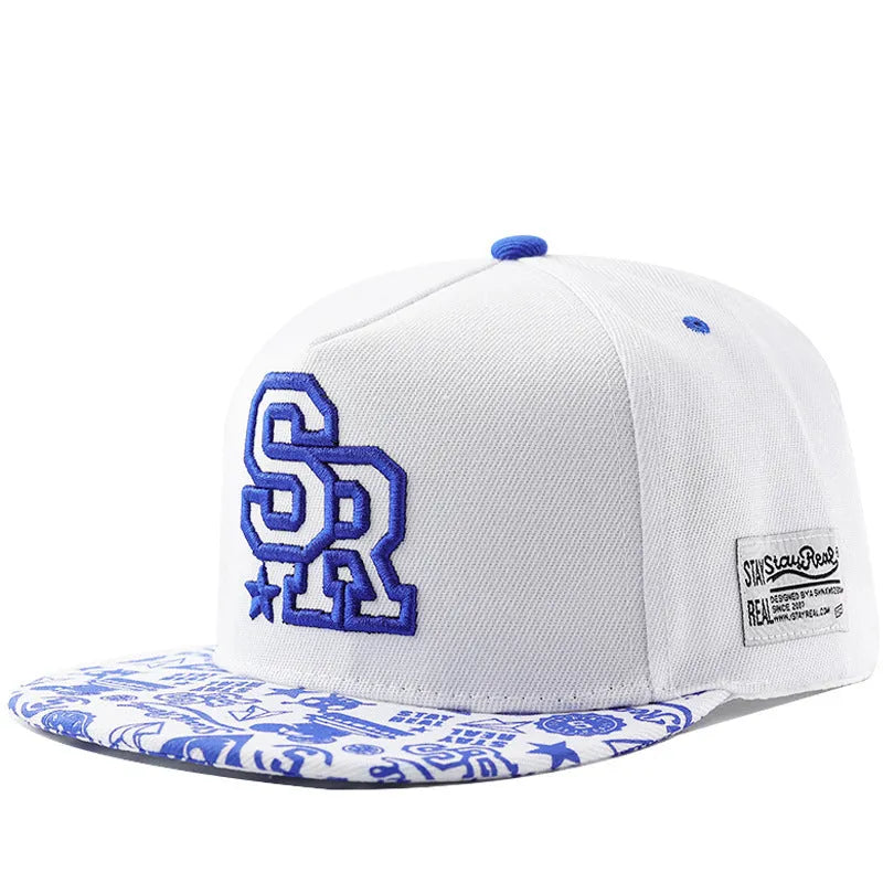 Black cotton baseball cap with white embroidered lettering on the front, showing adjustable back strap.