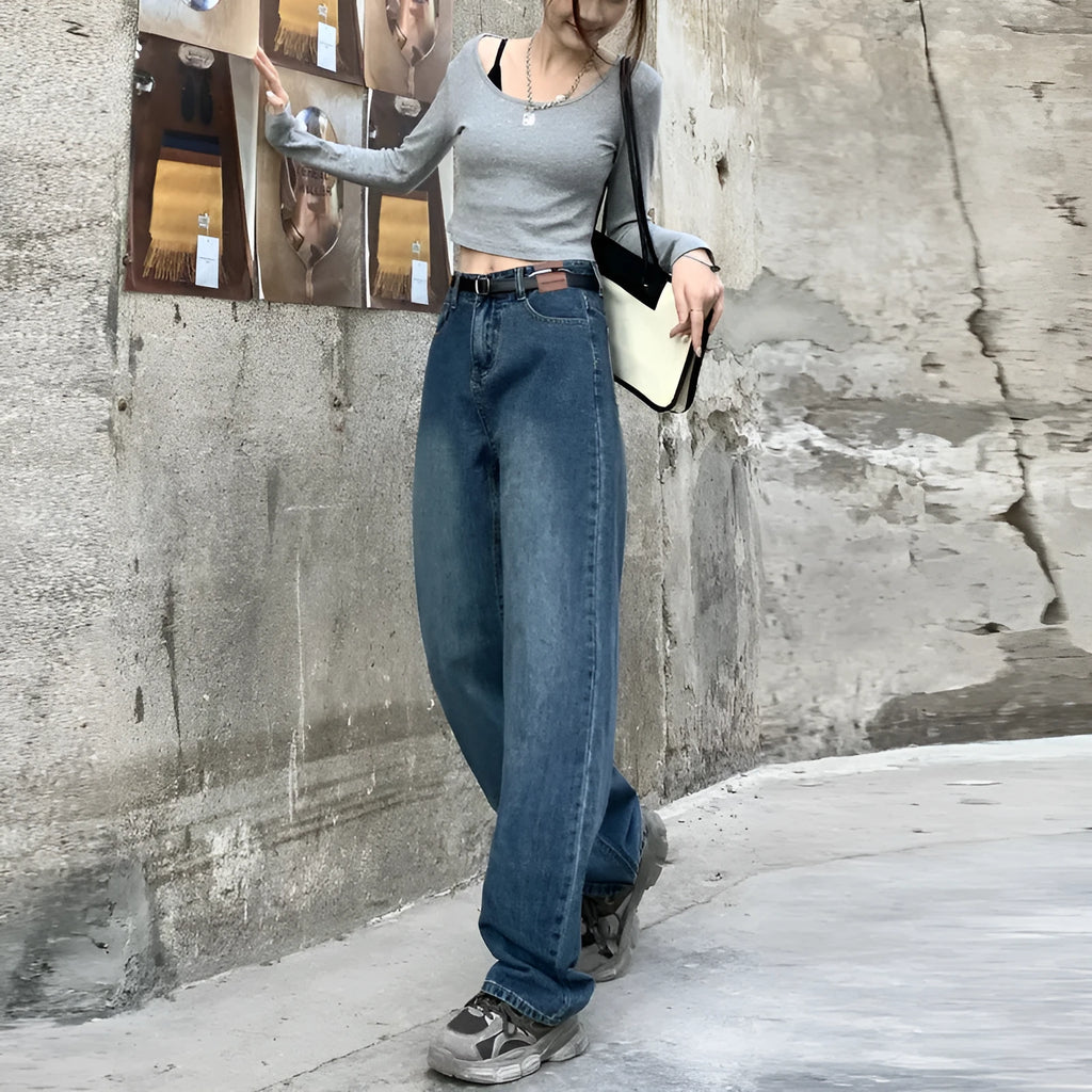 Woman wearing retro blue high-waisted straight-leg jeans in a cotton denim fabric.
