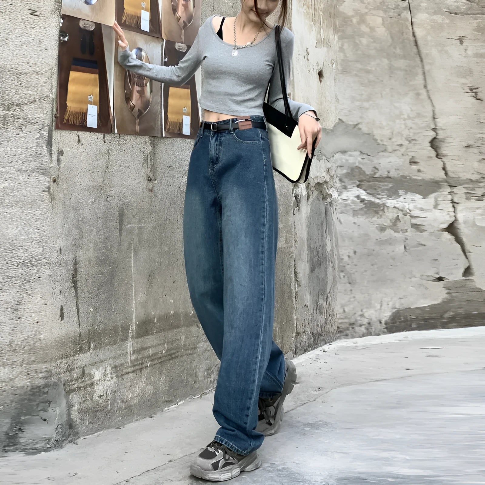 Woman wearing retro blue high-waisted straight-leg jeans in a cotton denim fabric.