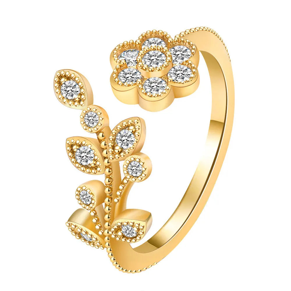Women's open mouth ring with flower and leaf design in gold or white colour with diamond treatment