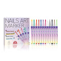 Twelve coloured nail art markers with fine tips arranged on a white background for DIY manicure