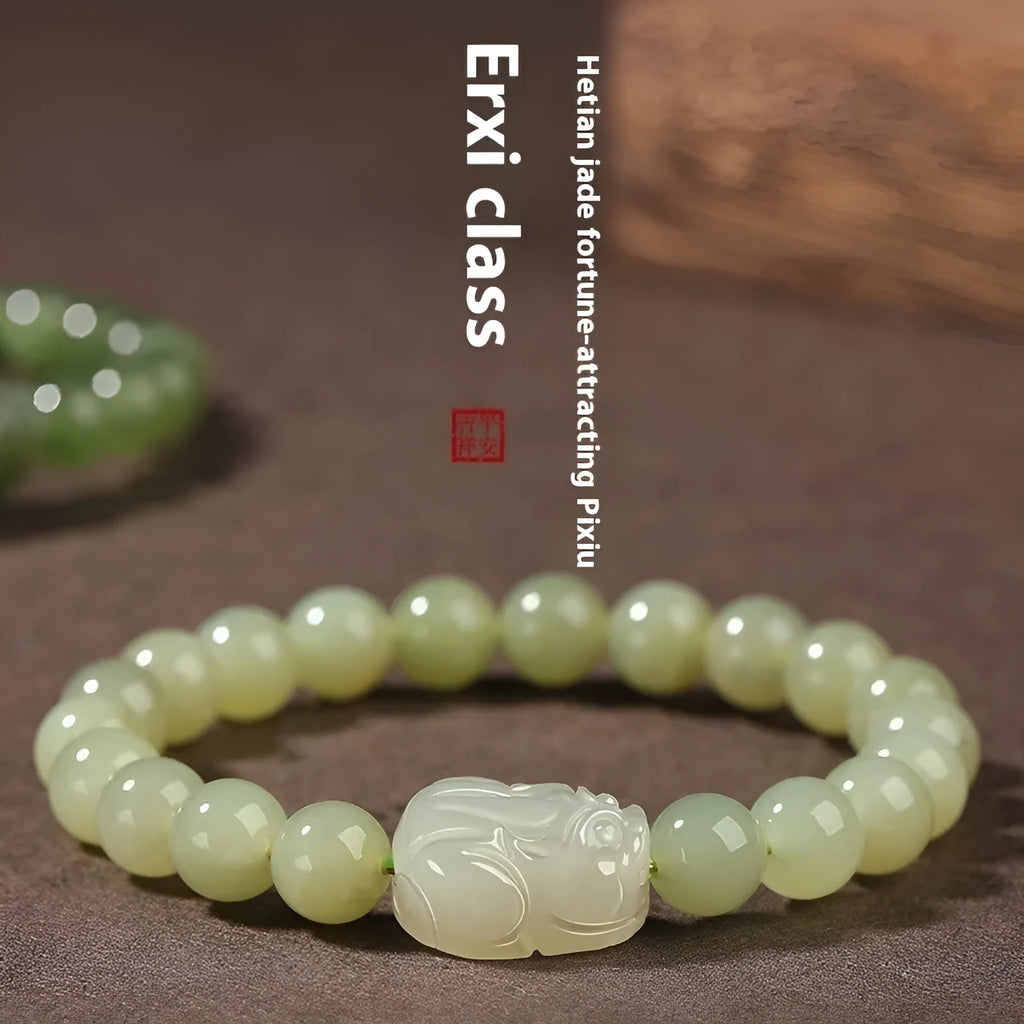 Grey Hetian jade ethnic style bracelet with polished beads on a wrist.