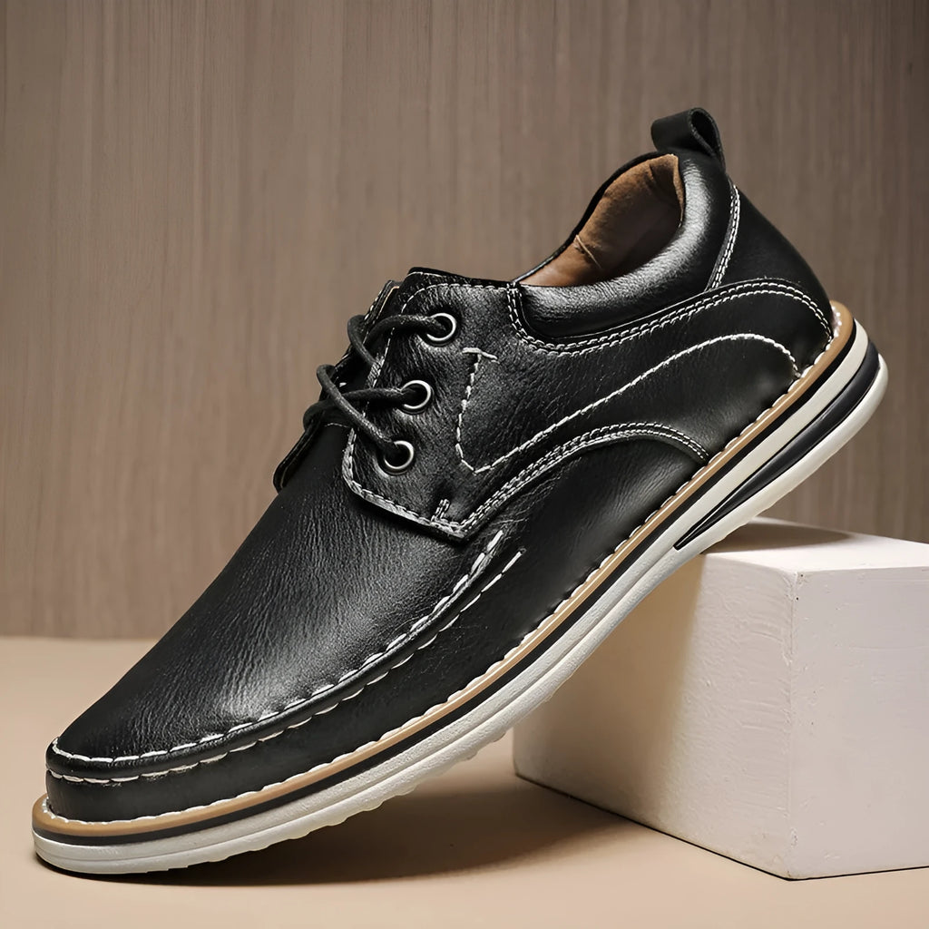 Men's black genuine leather casual lace-up shoes with round toe and low heel on a rubber sole.
