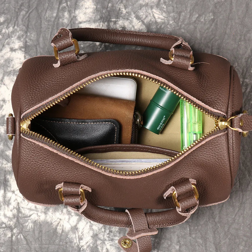 Brown yellow first layer cowhide Boston bag with cylindrical shape and single shoulder strap