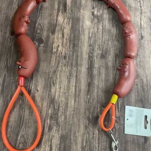 Brown pet hand rope leash with large sausage-shaped chew toys, measuring 108cm total length with grip tape section