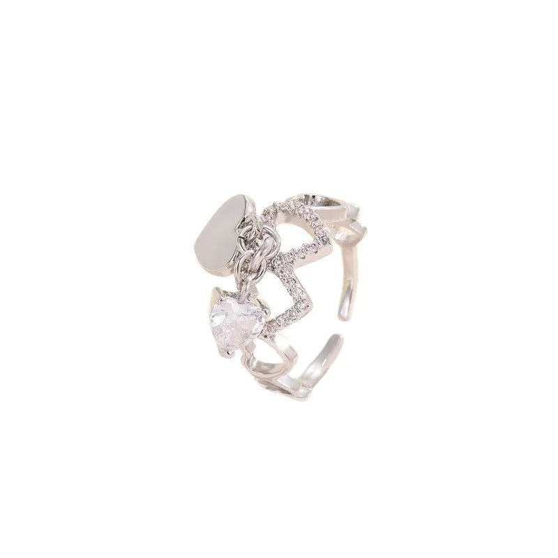 Silver electroplated copper adjustable heart ring for women on white background